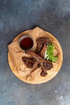 Roasted rack of lamb on the board. Stock Photos