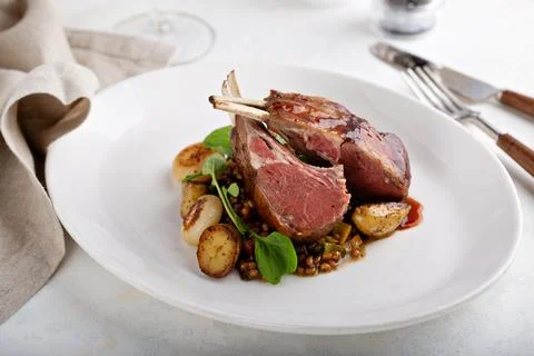 Roasted rack of lamb Stock Photos