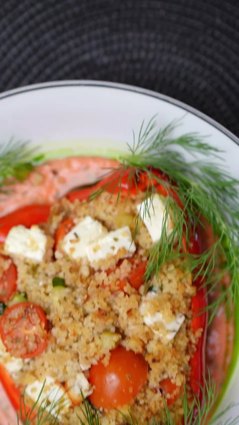 Roasted red bell pepper stuffed with herbed couscous, feta, cherry tomatoes Stock Footage 309170981
