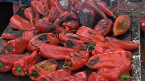 Roasted red peppers on rustic metal sheet cooke Stock Footage 141051284