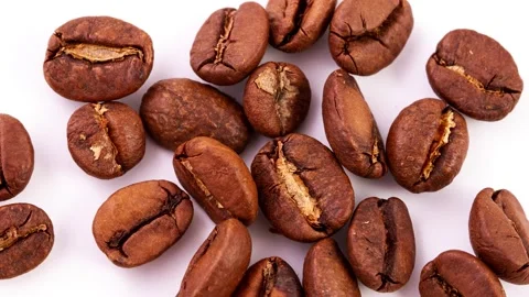 Roasted ripe brown coffee beans in a heap lie on a white background, Stock Footage 150806843