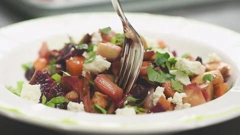 Roasted root vegetables salad, served in a plate. Stock Footage 159908471