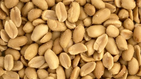 Roasted salted peanuts overhead rotation Stock Footage 86676471
