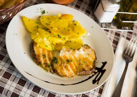 Roasted shark steak with salsa verde Stock Photos