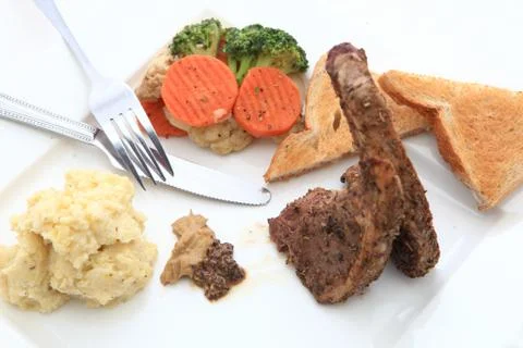Roasted sheep meat with bones on dish Foto stock