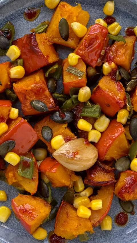 Roasted squash and green poblano pepper salad. Vertical video. Stock Footage 282800983