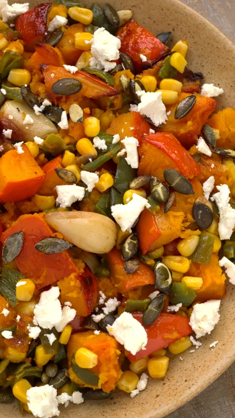 Roasted squash, corn, and green poblano pepper salad. Vertical video. Stock Footage 284310490