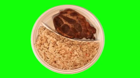 Roasted steak, rice with vegetables on throwaway plate, top shot Stock Footage 47553140