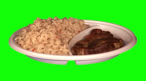 Roasted steak, rice with vegetables on throwaway plate Stock Footage 47555154