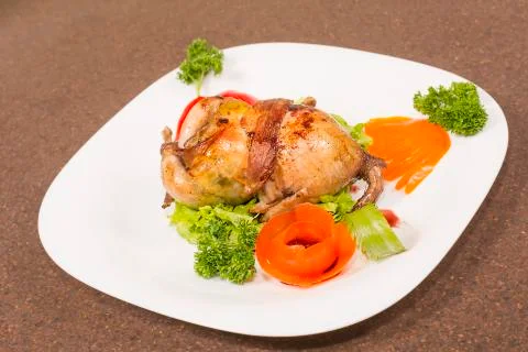 Roasted stuffed quail Stock Photos