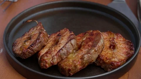 Roasted sturgeon steaks. Cooked fish fillet on a plate. Stock Footage 233498002