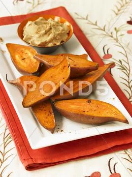 Roasted Sweet Potatoes with Cinnamon Butter Stock Photos