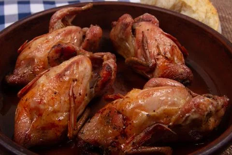 Roasted tiny chicken. Close-up. Stock Photos