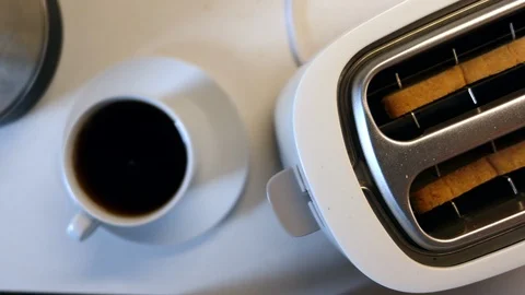 Roasted Toast Bread Popping Up From Toaster On The Background Of A Boiling Kettl Stock Footage 113803433
