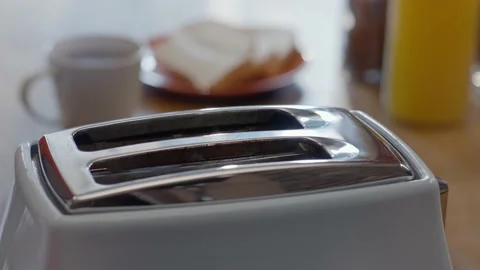 Roasted toast bread popping up from toaster machine. Stock Footage 148961189