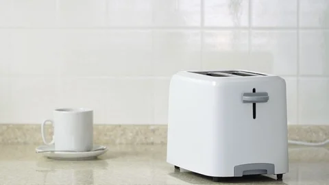 Roasted toast bread popping up from white modern toaster machine. 動画素材 87814380