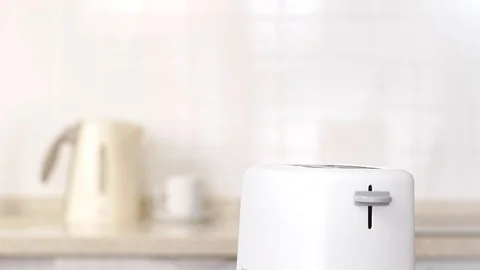 Roasted toast bread popping up from white modern toaster machine 動画素材 87814736