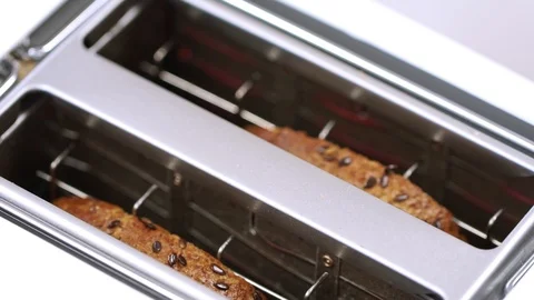 Roasted toast bread popping up from white modern toaster machine 動画素材 87815021