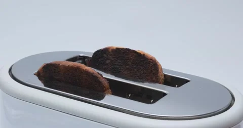 Roasted toast bread popping up from white modern toaster machine 動画素材 148953655