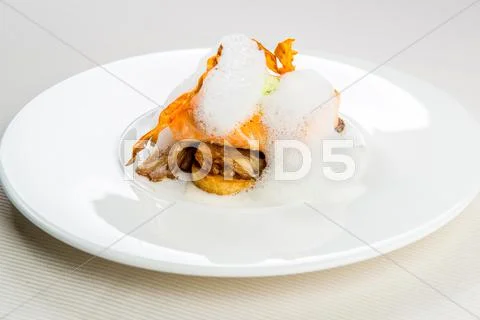 Roasted trout infused with milk foam Stock Photos