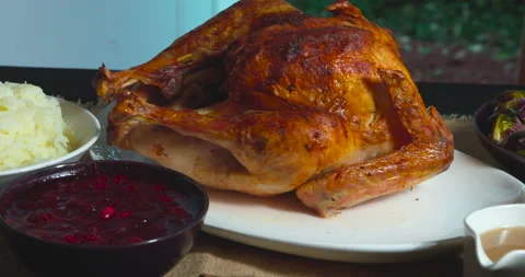 Roasted turkey and side dishes served for Thanksgiving or Christmas dinner. Stock Footage 143305850
