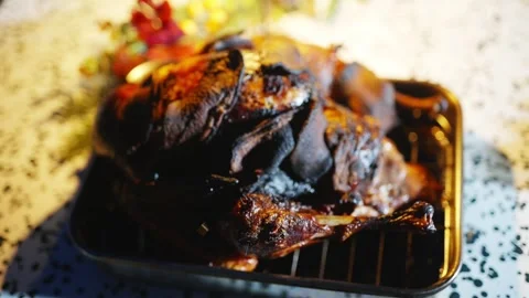 A roasted turkey with a lot of black stuff on it Video stock 295370561