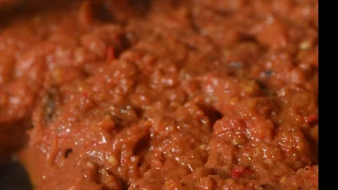 Roasted vegetable paste simmering in skillet, vegetarian dip or spread 스톡 동영상 327465043