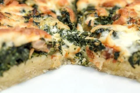 Roasted vegetable pie, with a wedge cut out Foto stock