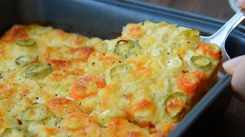 Roasted vegetables with cheese, egg and sour cream Stock Footage 69720304