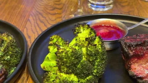 Roasted vegetables platter Rustic Platter of Roasted Vegetables on Wooden Table Stock Footage 325032735