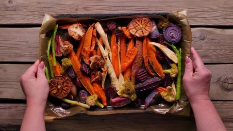 Roasted Vegetables Tray Placed on Table for Sunday Roast Stock Footage 327457930