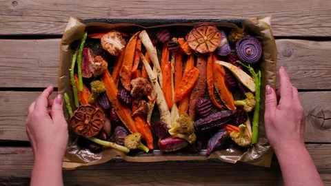 Roasted Vegetables Tray Placed on Table for Sunday Roast Stock Footage 334338213