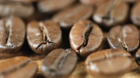 Roasted vietnamese coffee bean. Fragrant coffee beans scrolls slowly around the Stock Footage 153510876