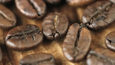 Roasted vietnamese coffee bean. Fragrant coffee beans scrolls slowly around the  Stock Footage 154147132