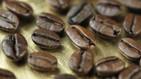 Roasted vietnamese coffee bean. Fragrant coffee beans scrolls slowly around the  Stock Footage 154153473