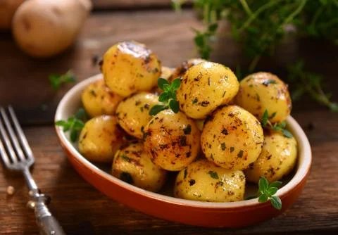 Roasted young potatoes Stock Photos