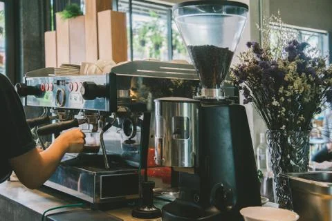 Roaster is making coffee with coffee machine Stock Photos