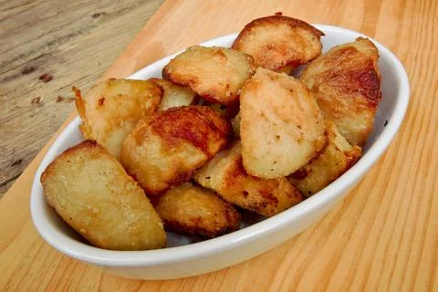 Roasties in a serving dish Stock Photos