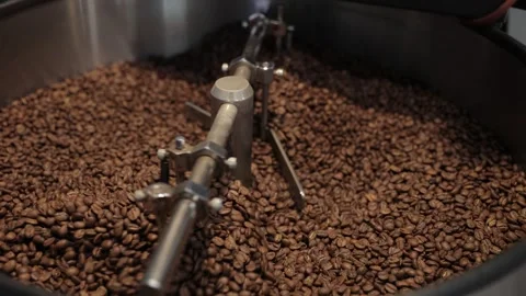 Roasting and Mixing Coffee Beans in a Roaster Stock Footage 245435897