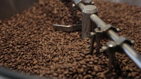 Roasting and Mixing Coffee Beans in a Roaster Stock Footage 246425211