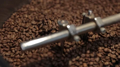Roasting and Mixing Coffee Beans in a Roaster Stock Footage 246909551