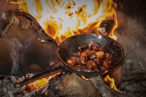 Roasting chestnuts on fire in a pan 스톡 사진