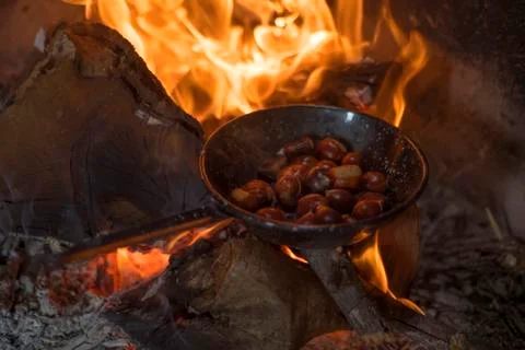 Roasting chestnuts on fire in a pan 스톡 사진