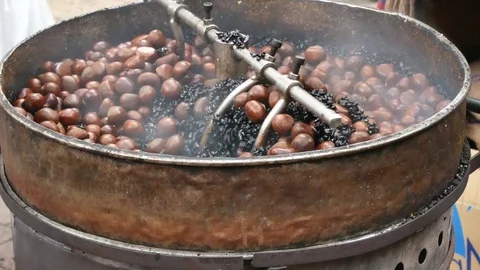 Roasting chestnuts in a machine. 動画素材 80861835