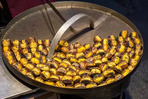 Roasting chestnuts at streets Stock Photos