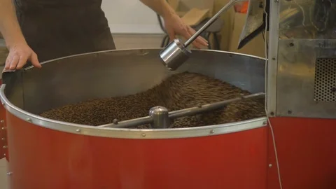 Roasting coffee beans in the oven. Coffee production. Stock Footage 82505134