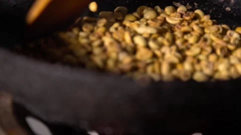 Roasting coffee beans in a pan - raw coffee Stock-Footage 146472476