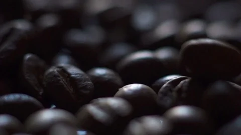 Roasting coffee beans with smoke on dark background Stock Footage 73184987