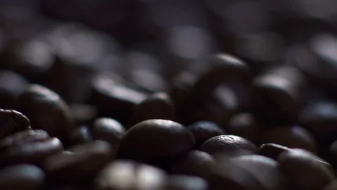 Roasting coffee beans with smoke on dark background Stock Footage 73333221
