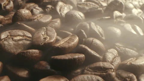 From roasting coffee beans, soft diffuse smoke emanating from roasted coffee Video stock 229655898